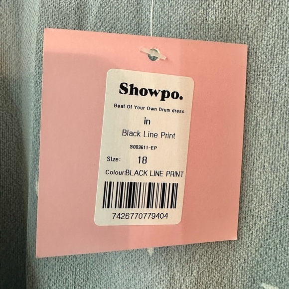 NWT Showpo Beat Of Your Own Drum Dress in Black Line Print Wrap Dress - Picture 4 of 8